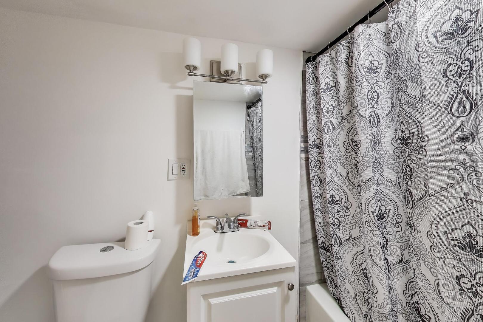8822 South Ada Street Chicago, IL 60620 - Photo 21 of 25 a bathroom with a sink and toilet