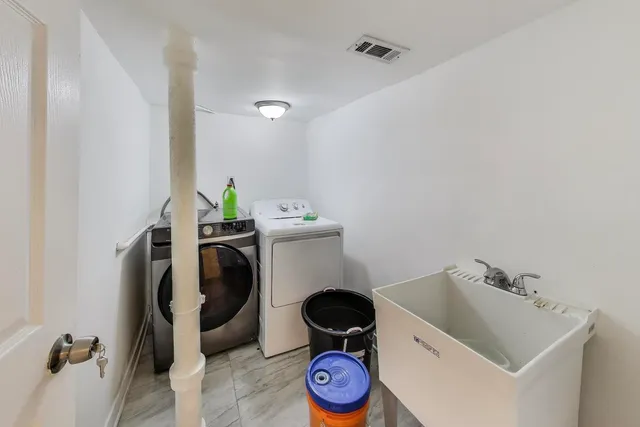 a bathroom with a toilet and a sink