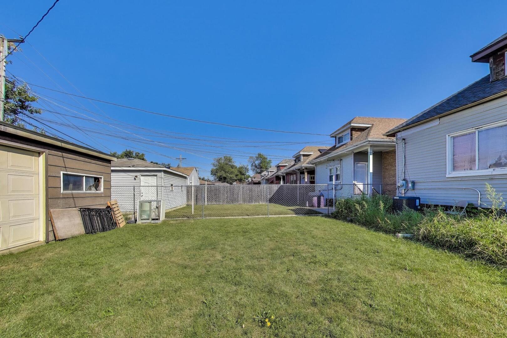8822 South Ada Street Chicago, IL 60620 - Photo 25 of 25 a house view with a garden space