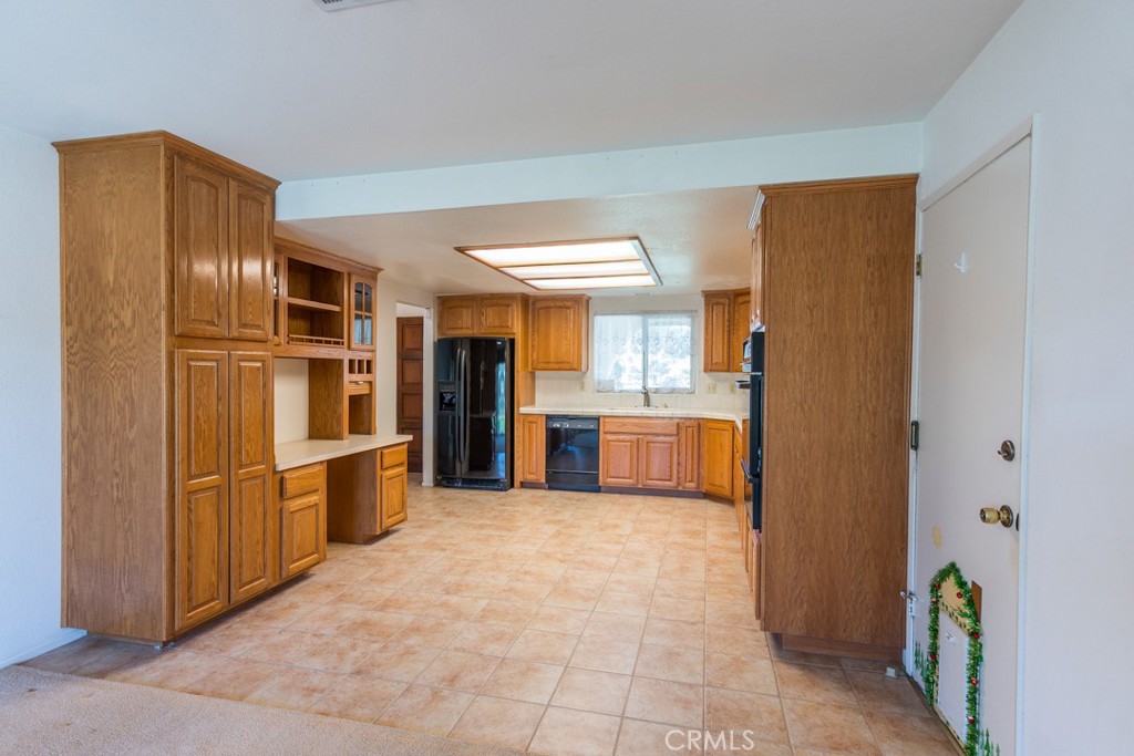 4628 West Ave K8 Quartz Hill, CA 93536 - Photo 14 of 57 a kitchen with stainless steel appliances a refrigerator and a stove