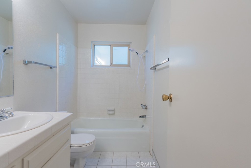 4628 West Ave K8 Quartz Hill, CA 93536 - Photo 21 of 57 a bathroom with a sink a toilet and shower