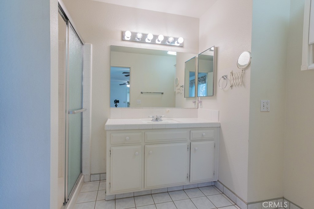 4628 West Ave K8 Quartz Hill, CA 93536 - Photo 26 of 57 a bathroom with a sink and a mirror