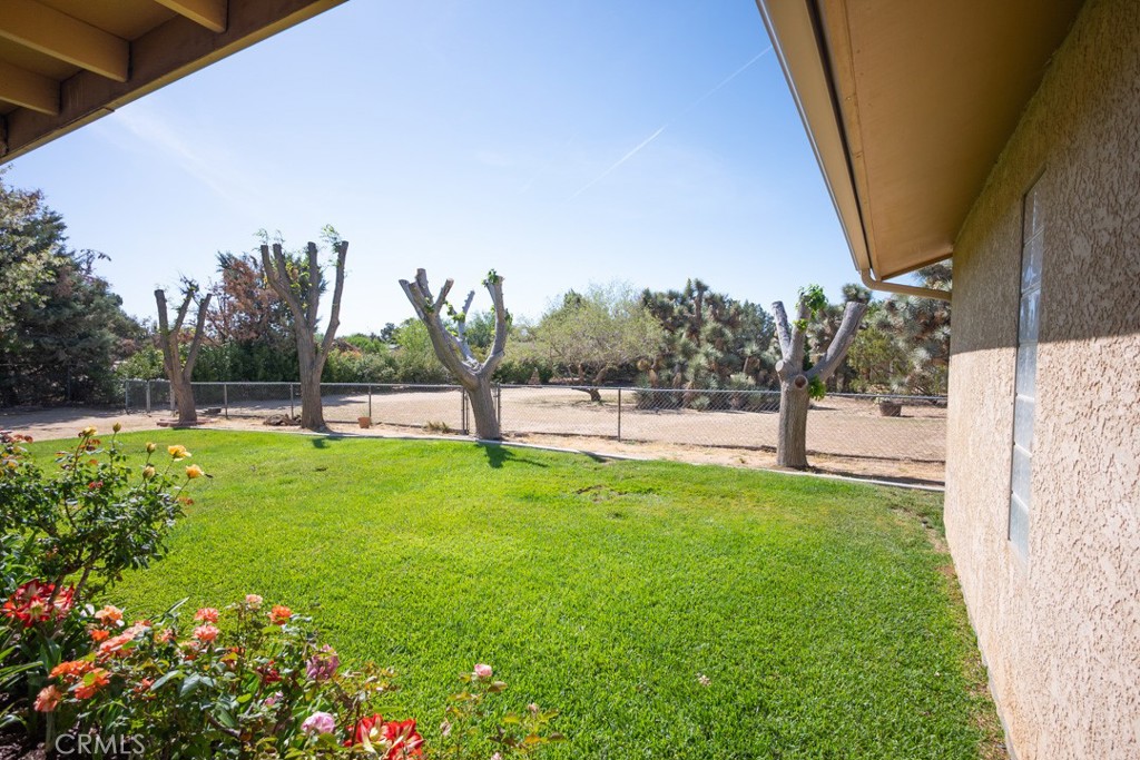 4628 West Ave K8 Quartz Hill, CA 93536 - Photo 29 of 57 a view of yard with grass and trees