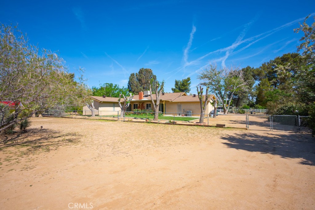 4628 West Ave K8 Quartz Hill, CA 93536 - Photo 42 of 57 a swimming pool with outdoor seating and yard