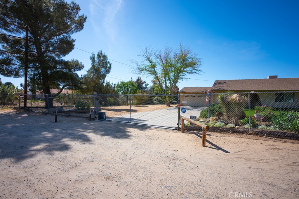 4628 West Ave K8 Quartz Hill, CA 93536 - Photo 45 of 57 a view of a park with potted plants and palm trees