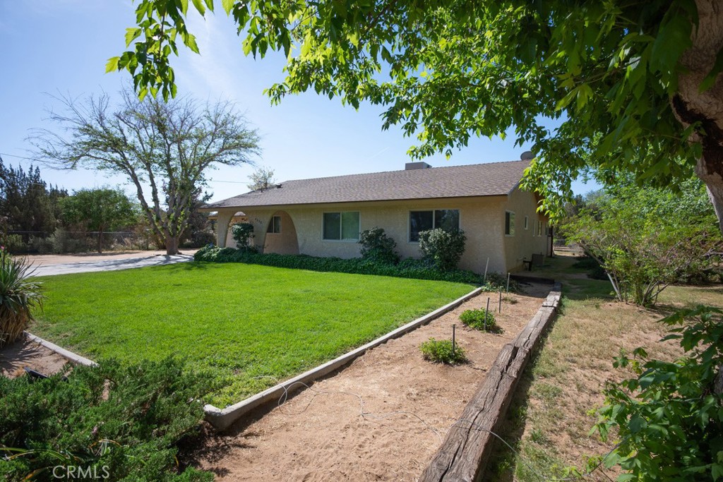 4628 West Ave K8 Quartz Hill, CA 93536 - Photo 46 of 57 a view of a house with a yard