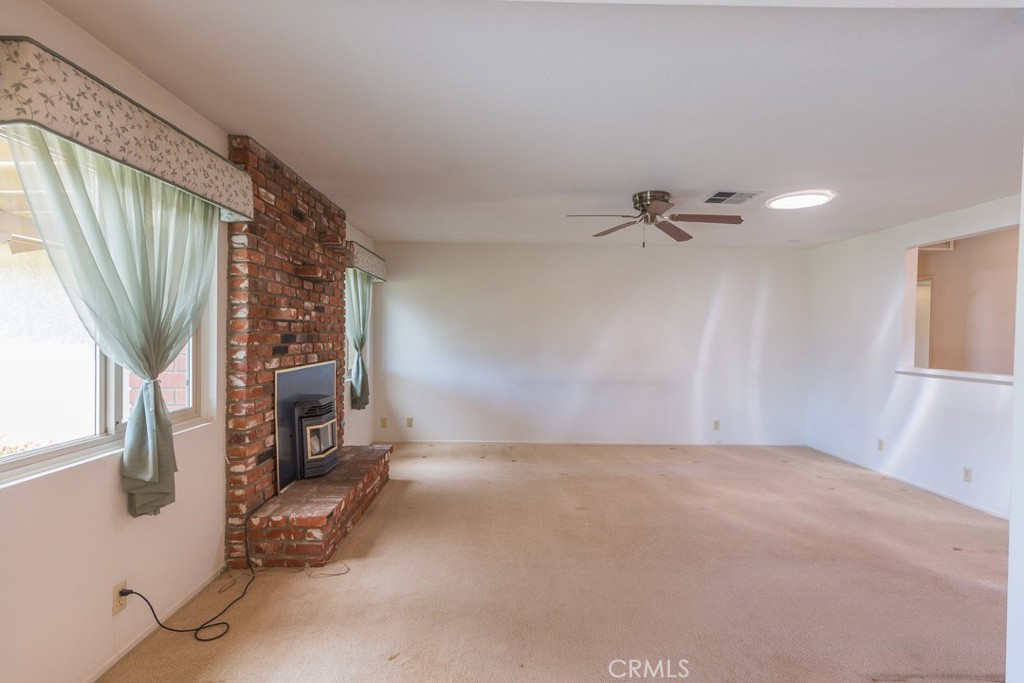 4628 West Ave K8 Quartz Hill, CA 93536 - Photo 7 of 57 a view of a livingroom with a fireplace