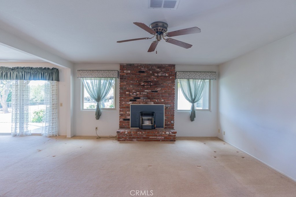4628 West Ave K8 Quartz Hill, CA 93536 - Photo 9 of 57 a living room with fireplace