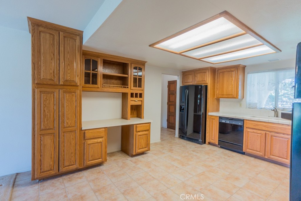 4628 West Ave K8 Quartz Hill, CA 93536 - Photo 10 of 57 a kitchen with stainless steel appliances granite countertop a refrigerator and cabinets
