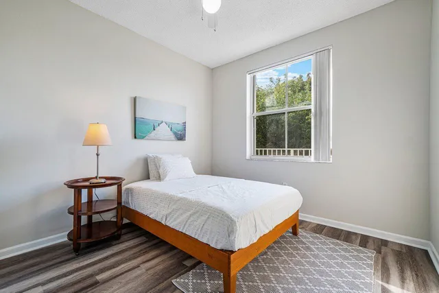 a bedroom with a bed and window