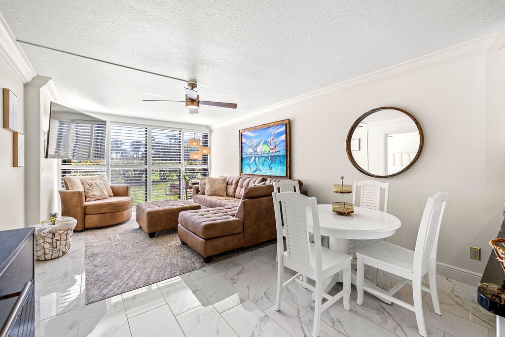 2400 South Ocean Drive, Unit 913 Fort Pierce, FL 34949 - Photo 11 of 36 a living room with furniture and a large window