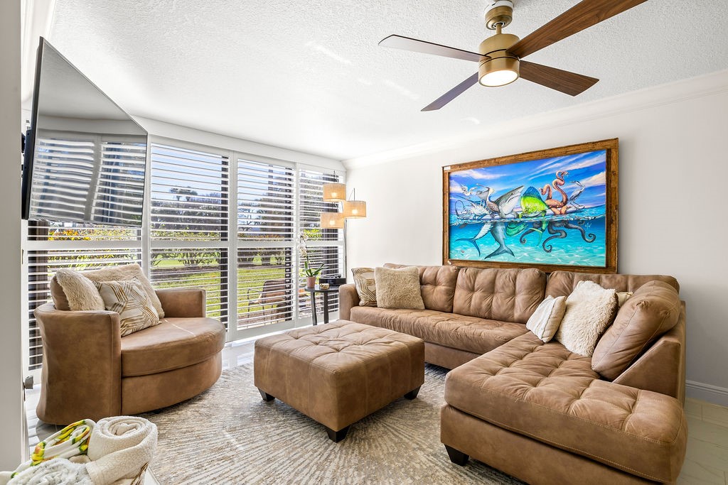 2400 South Ocean Drive, Unit 913 Fort Pierce, FL 34949 - Photo 2 of 36 a living room with furniture and a large window
