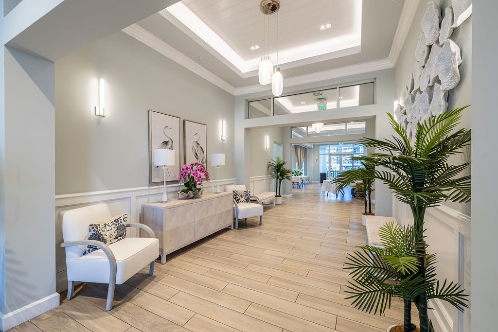 2400 South Ocean Drive, Unit 913 Fort Pierce, FL 34949 - Photo 24 of 36 a living room with furniture and a potted plant