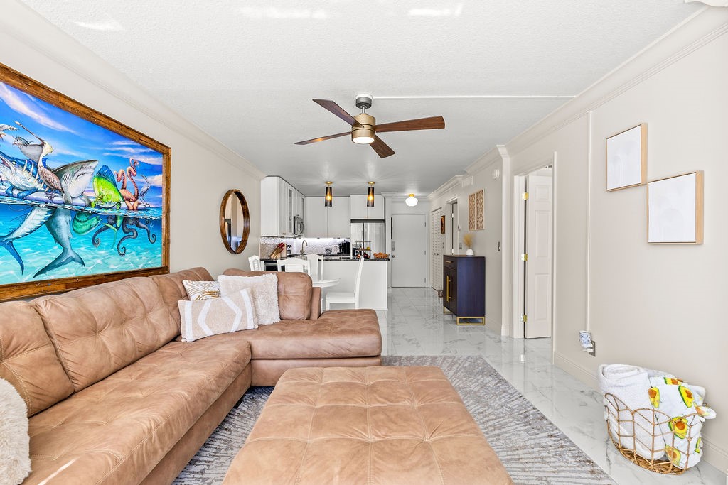 2400 South Ocean Drive, Unit 913 Fort Pierce, FL 34949 - Photo 3 of 36 a living room with furniture and painting on the wall