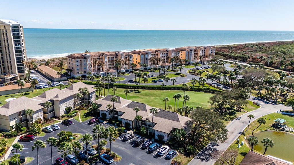2400 South Ocean Drive, Unit 913 Fort Pierce, FL 34949 - Photo 35 of 36 an aerial view of a city with lots of residential buildings ocean and mountain view in back