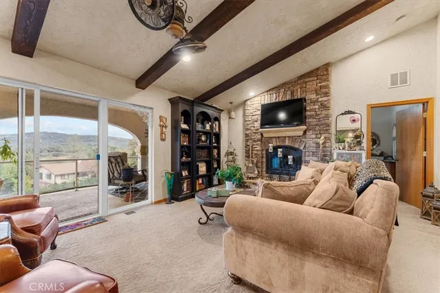 a living room with furniture a rug and white walls