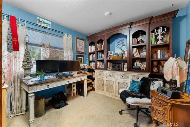 a bed room with a bed and a tv