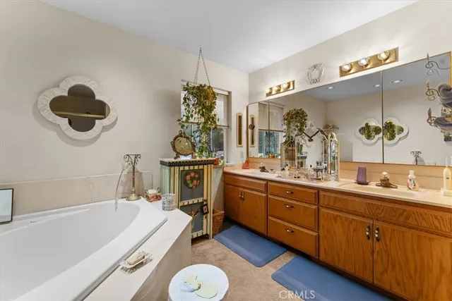 a bedroom with furniture and a large window