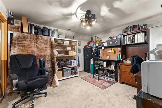 a view of a chairs and table in the balcony