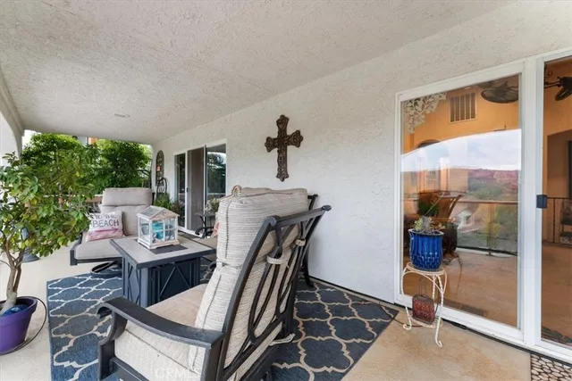 a view of balcony with furniture