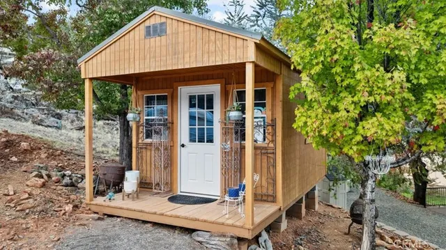 an aerial view of residential houses with outdoor space
