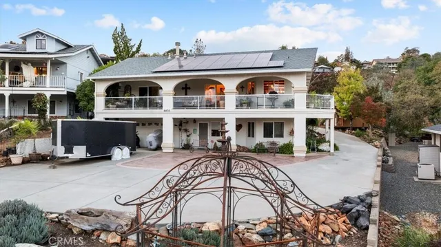an aerial view of residential building with outdoor space and river