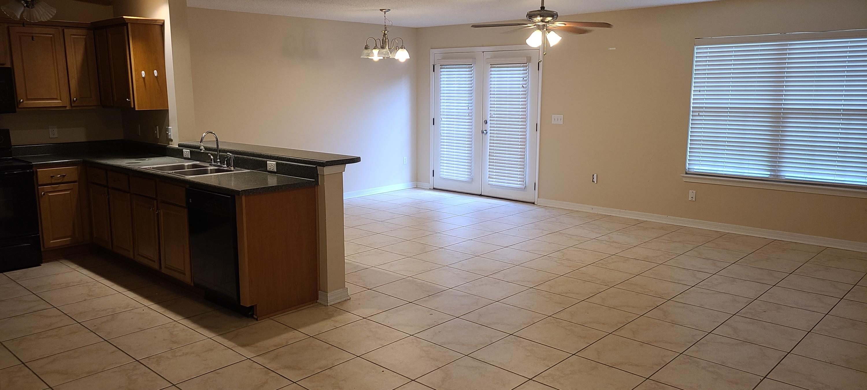 291 Dahlquist Drive Crestview, FL 32539 - Photo 13 of 25 a kitchen with stainless steel appliances granite countertop a sink and a stove