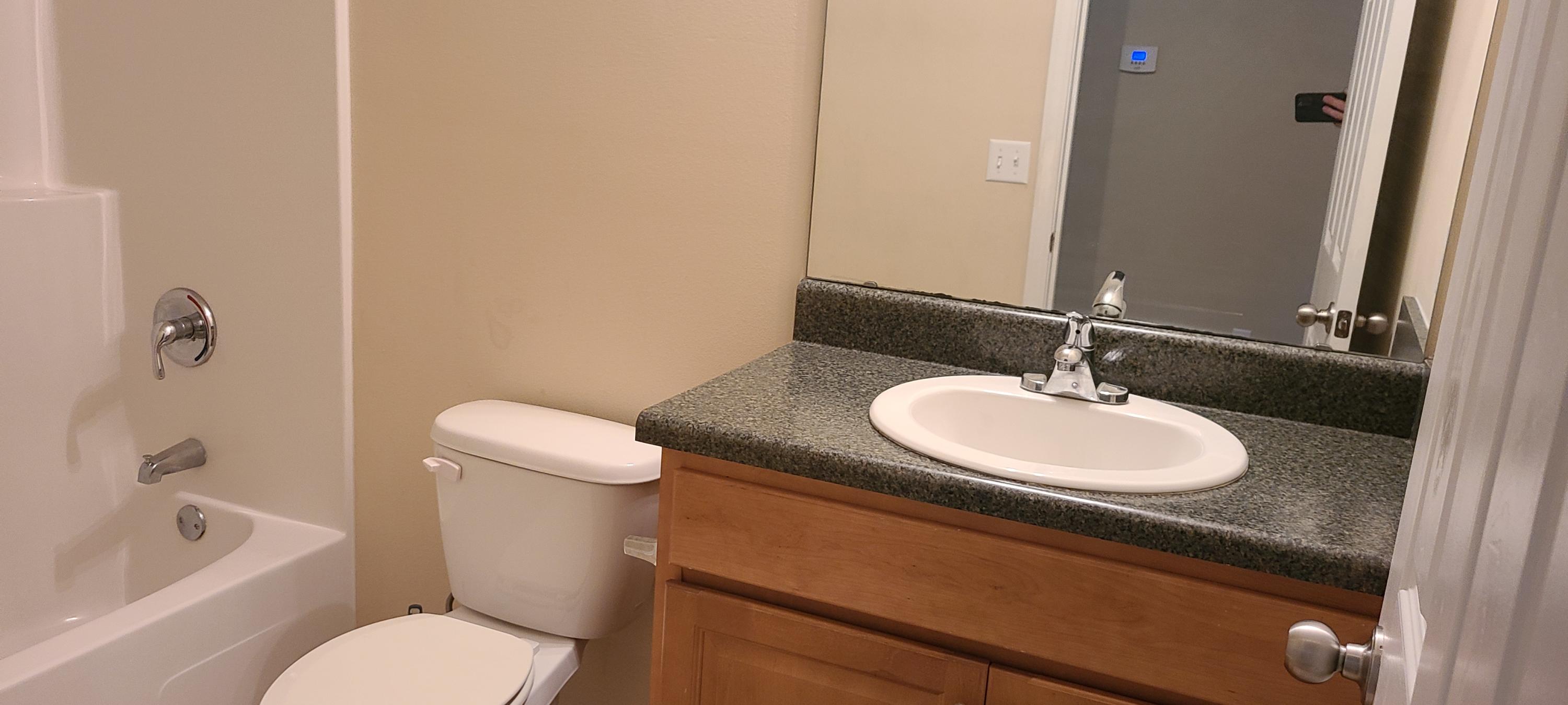 291 Dahlquist Drive Crestview, FL 32539 - Photo 21 of 25 a bathroom with a granite countertop sink and a mirror