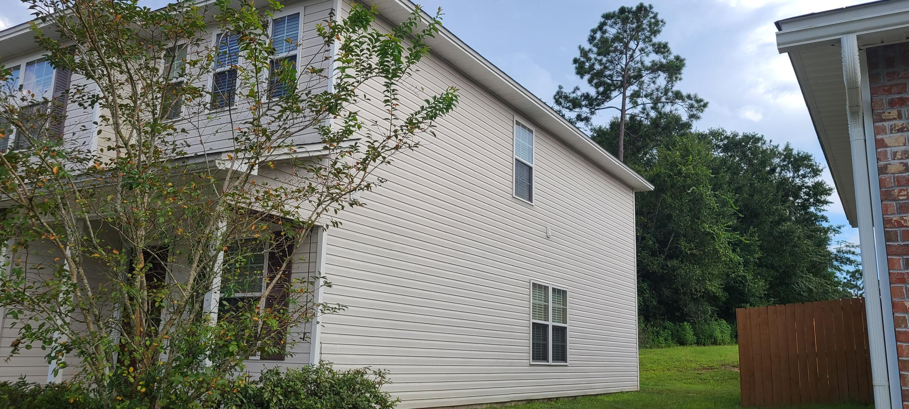 291 Dahlquist Drive Crestview, FL 32539 - Photo 3 of 25 a view of a house with a yard