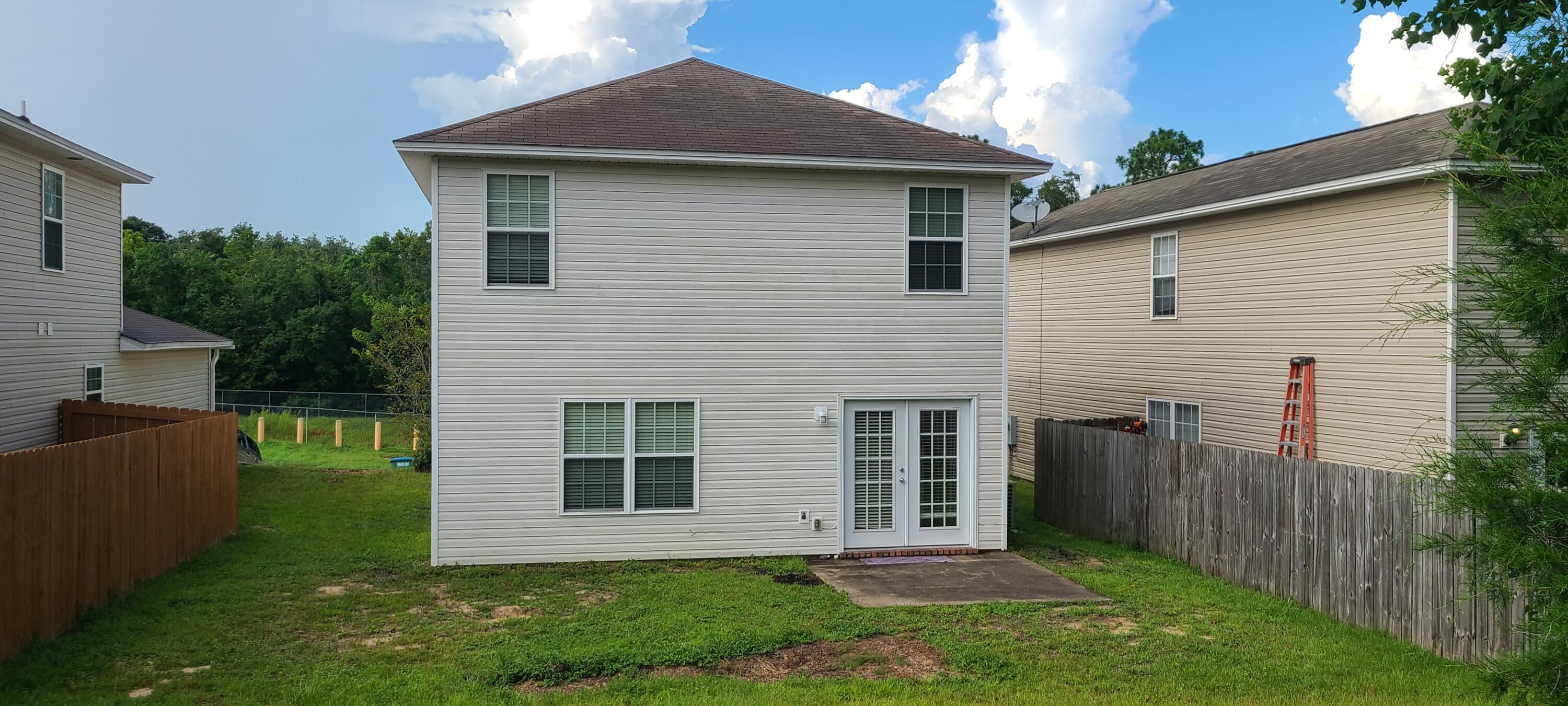 291 Dahlquist Drive Crestview, FL 32539 - Photo 7 of 25 a front view of a house with a yard
