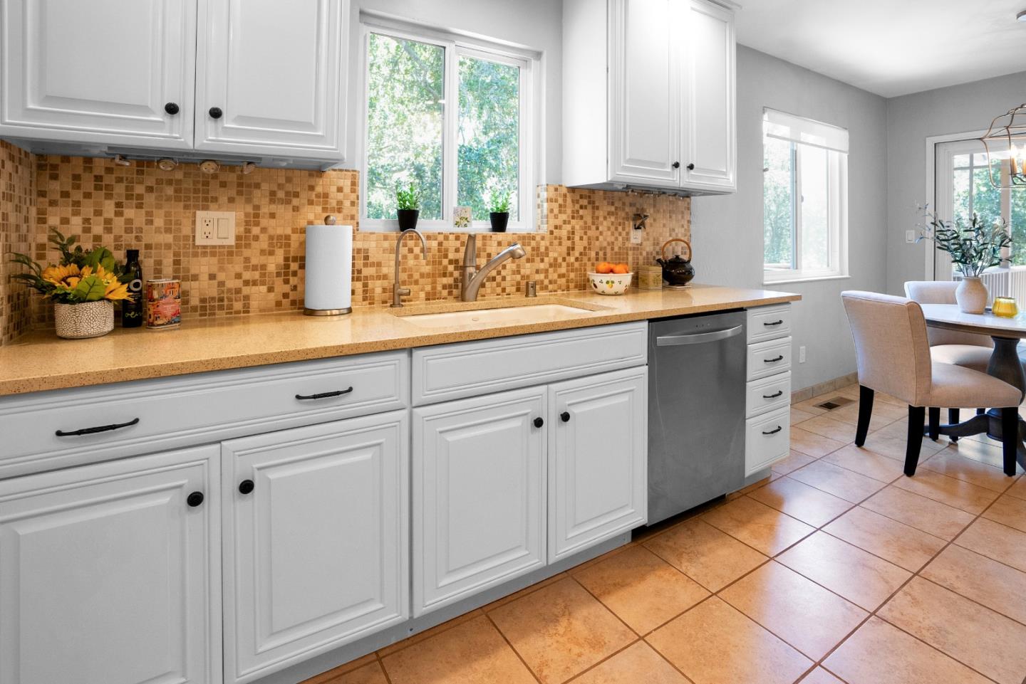 455 San Bernabe Drive Monterey, CA 93940 - Photo 17 of 32 a kitchen with white cabinets and window