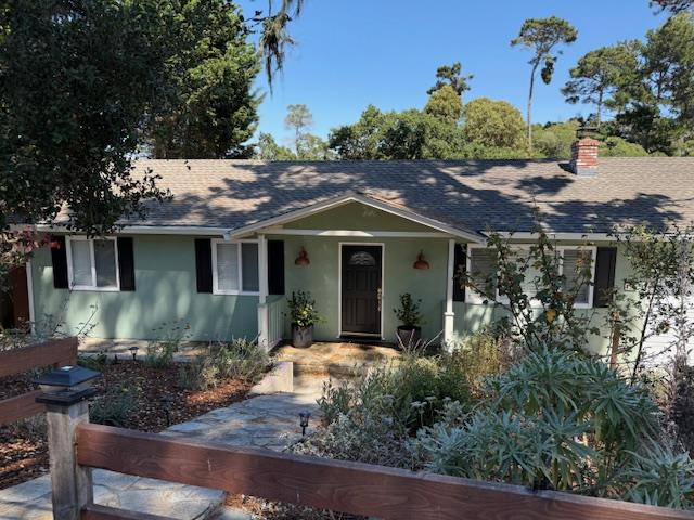 455 San Bernabe Drive Monterey, CA 93940 - Photo 4 of 32 a front view of a house with a garden