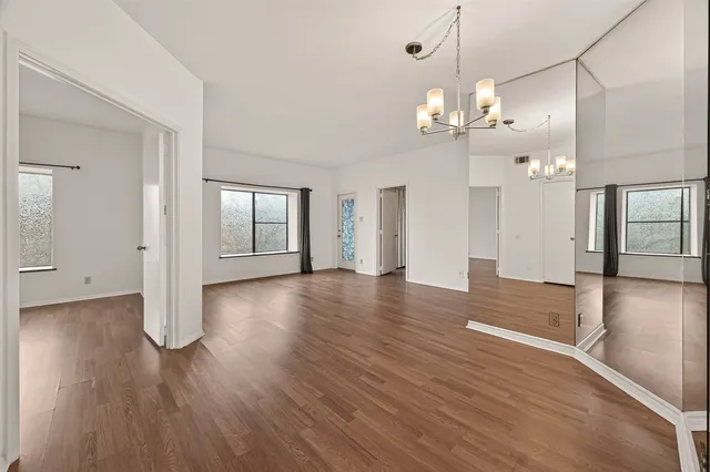 a view of a livingroom with wooden floor
