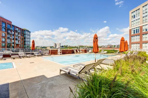 a view of a swimming pool with a lounge chairs