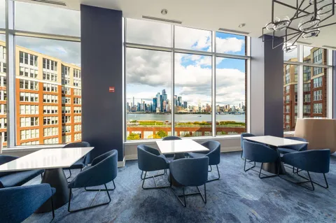 a view of a dining room with furniture window and outside view