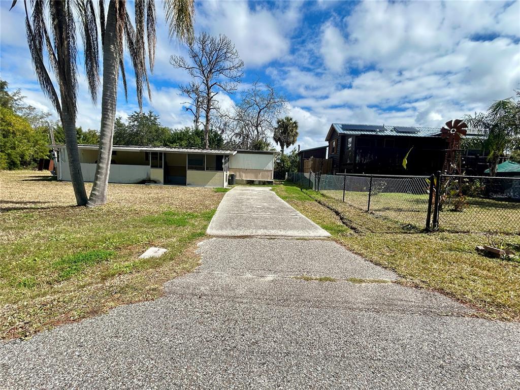 6116 Countryman Lane New Port Richey, FL 34652 - Photo 2 of 9 a view of a backyard with sitting area