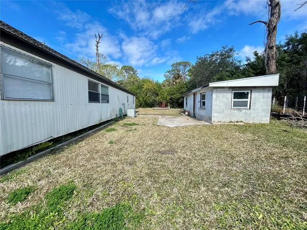 a view of a backyard of the house