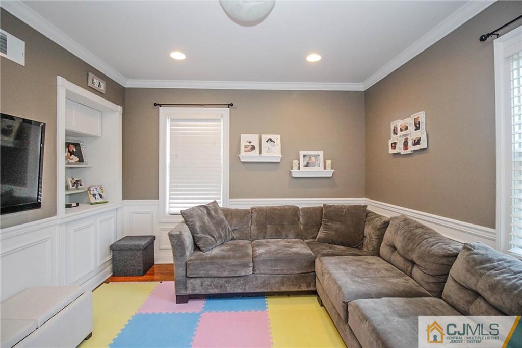 128 Morningside Road Colonia, NJ 07067 - Photo 13 of 25 a living room with furniture and a flat screen tv