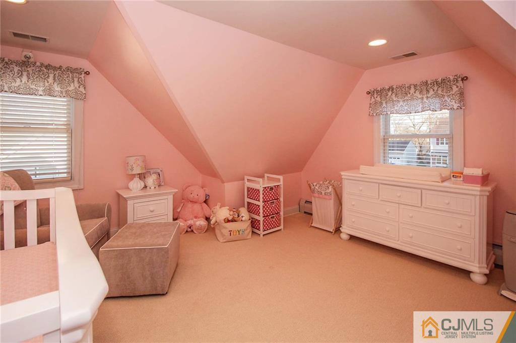 128 Morningside Road Colonia, NJ 07067 - Photo 18 of 25 a bedroom with furniture and a window
