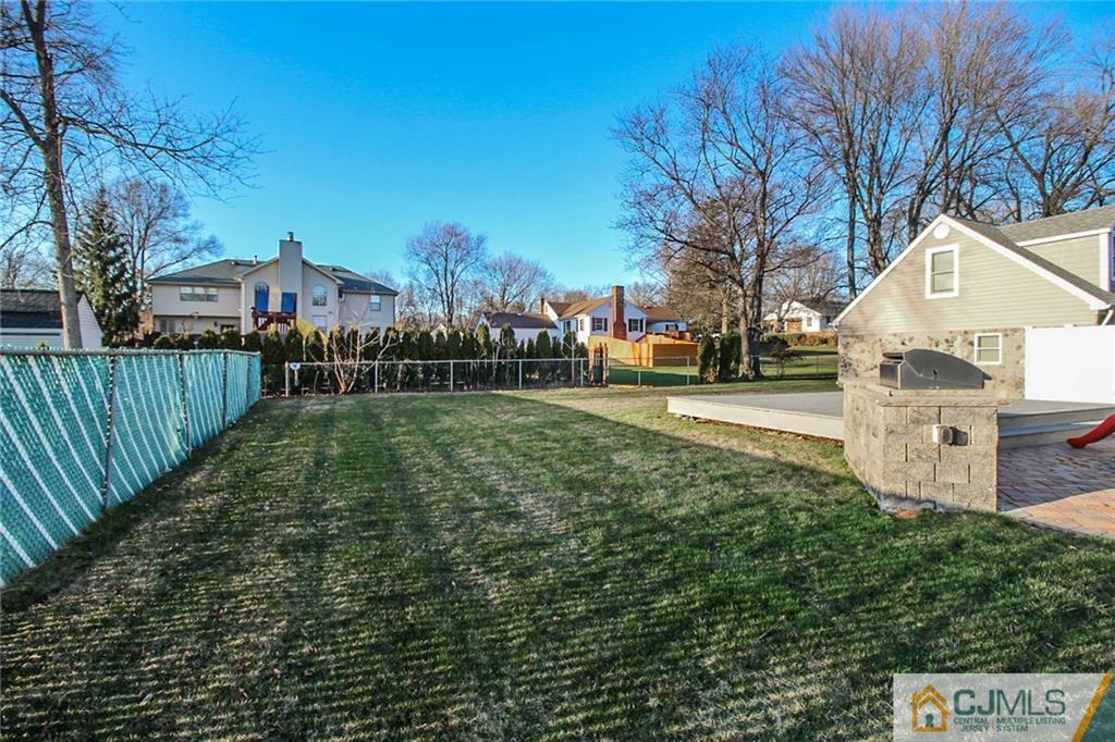 128 Morningside Road Colonia, NJ 07067 - Photo 24 of 25 a view of a street with a house in the background