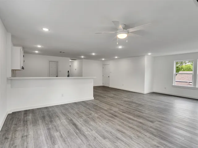 a view of a porch with wooden floor
