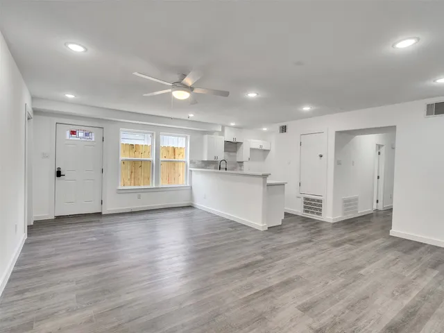 a kitchen with a sink and a stove top oven