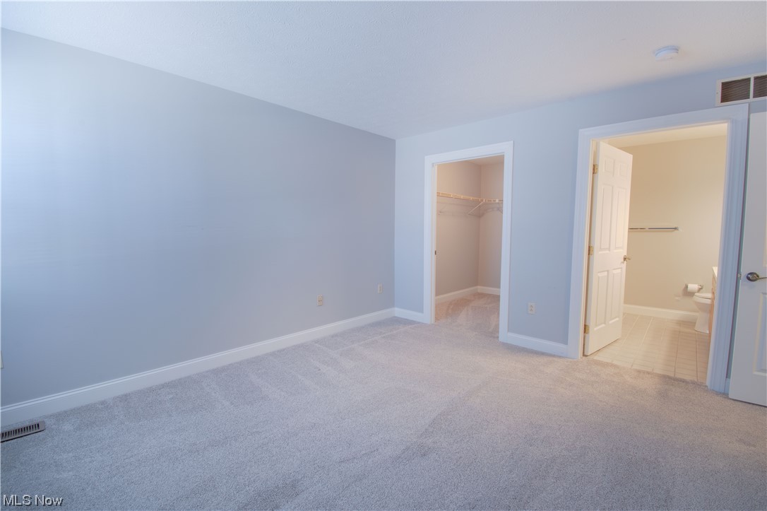 105 Furnace Run Road, Unit 105 Akron, OH 44307 - Photo 12 of 22 The first-floor master bedroom has an on-suite full bath and a walk-in closet.