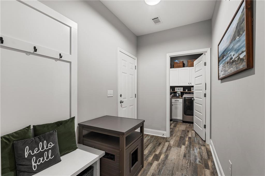 3696 Lee Road Salem, AL 36874 - Photo 17 of 36 Built-in bench with coat hooks, wood-finish flooring, recessed lighting, white interior doors, and laundry area with cabinetry