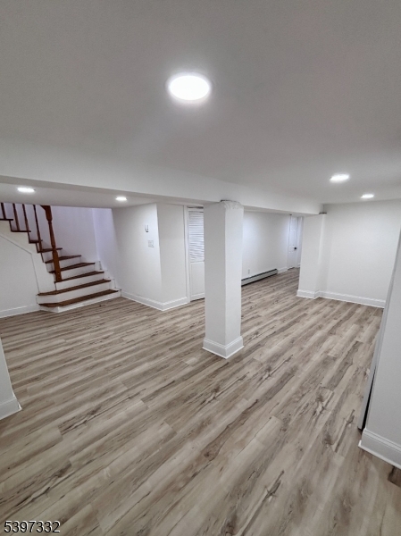 48 North York Street, Unit 1F Paterson, NJ 07524 - Photo 11 of 18 a view of an empty room with wooden floor