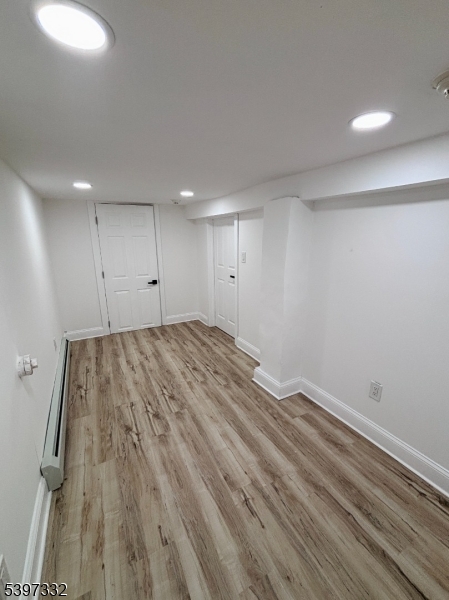 48 North York Street, Unit 1F Paterson, NJ 07524 - Photo 13 of 18 a view of room with wooden floor