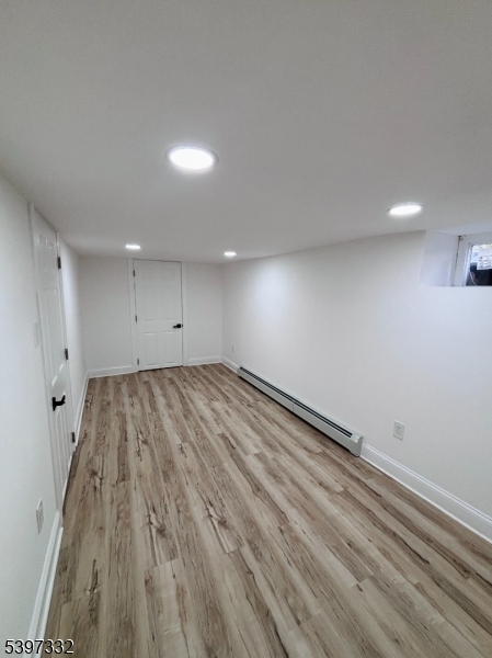 48 North York Street, Unit 1F Paterson, NJ 07524 - Photo 14 of 18 a view of empty room with wooden floor