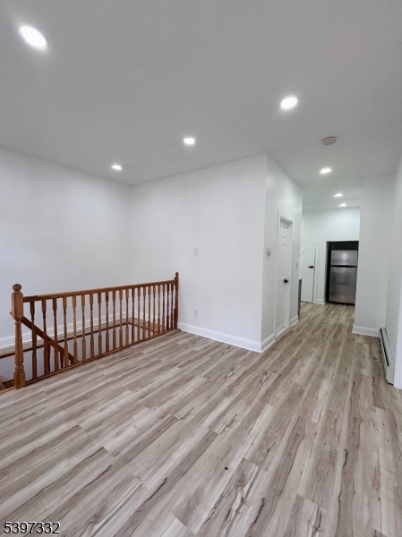 48 North York Street, Unit 1F Paterson, NJ 07524 - Photo 3 of 18 a view of a room with wooden floor