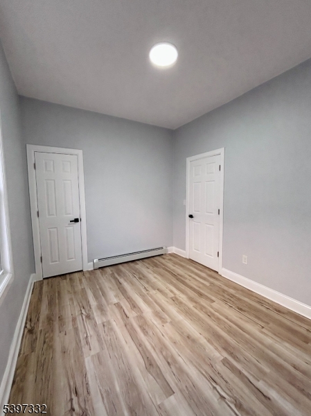48 North York Street, Unit 1F Paterson, NJ 07524 - Photo 6 of 18 a view of an empty room with wooden floor
