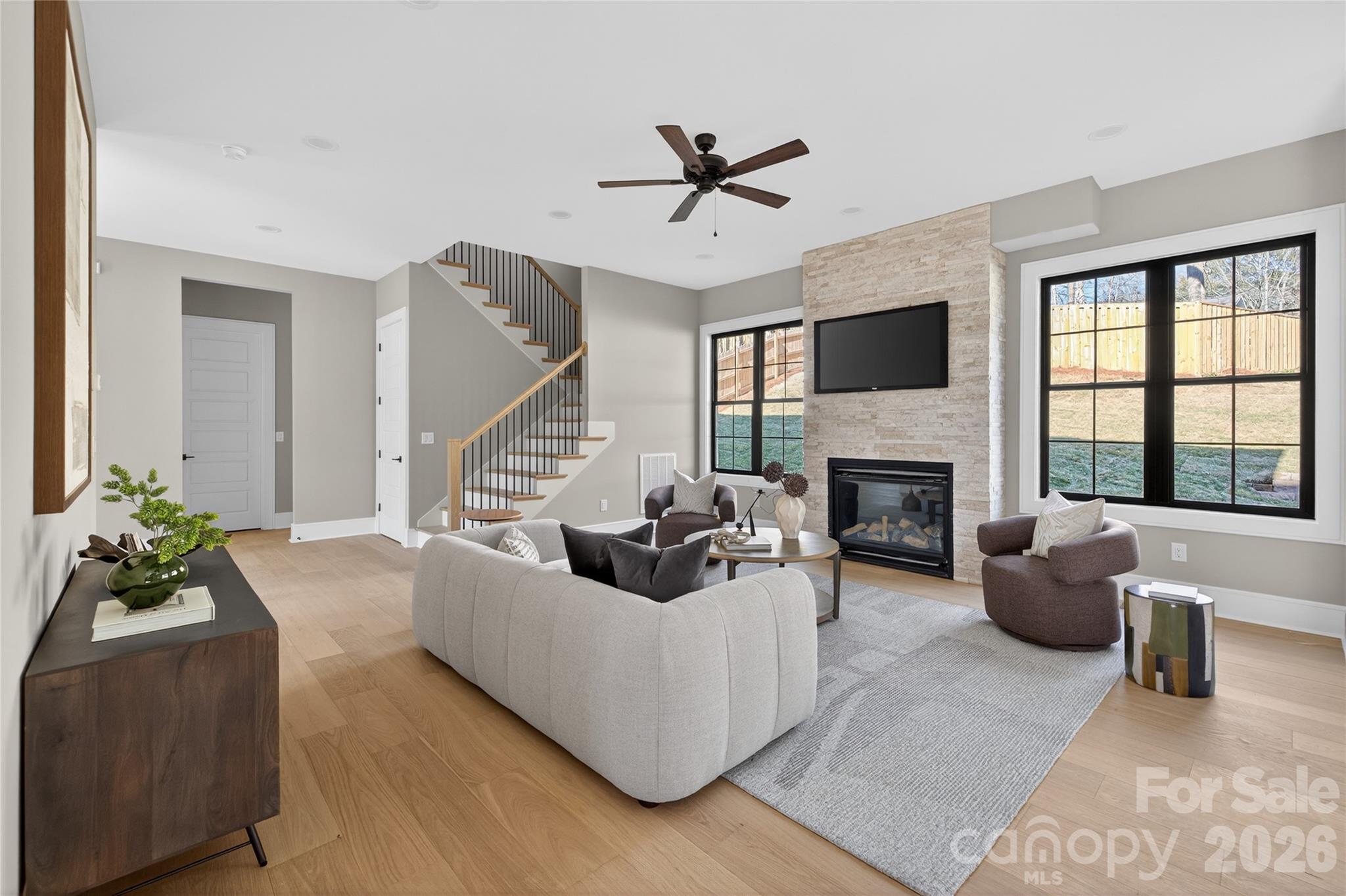 6811 Burlwood Road Charlotte, NC 28211 - Photo 12 of 43 a living room with furniture fireplace and a large window